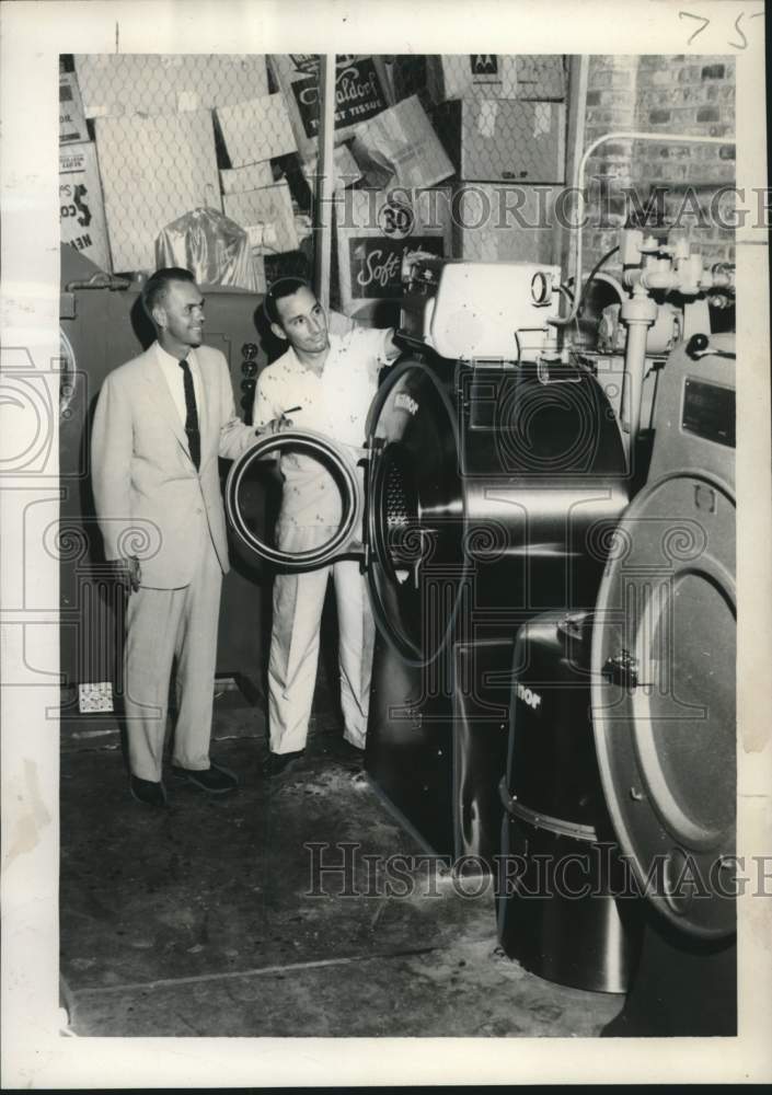 Load image into Gallery viewer, 1957 Press Photo Herman S. Jones Junior, Goodwill Industries, Dry Cleaning
