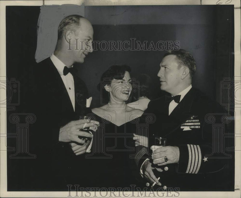 Load image into Gallery viewer, 1950 Press Photo Captain &amp; Mrs. Harris, Captain William S. Harris at a party
