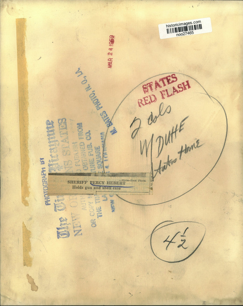 1959 Press Photo Sheriff Percy Hebert holds gun and shell case - noo27465