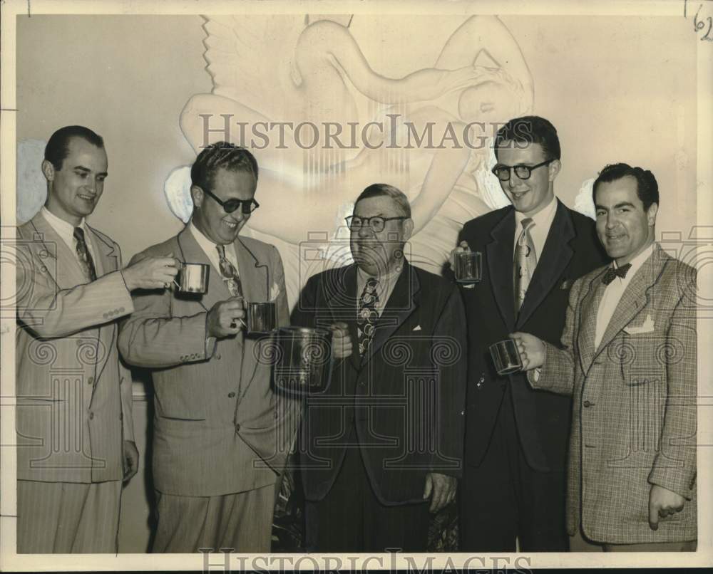 1950 Press Photo Hy Heath Enjoys Moscow Muth at New Orleans Party with Attendees