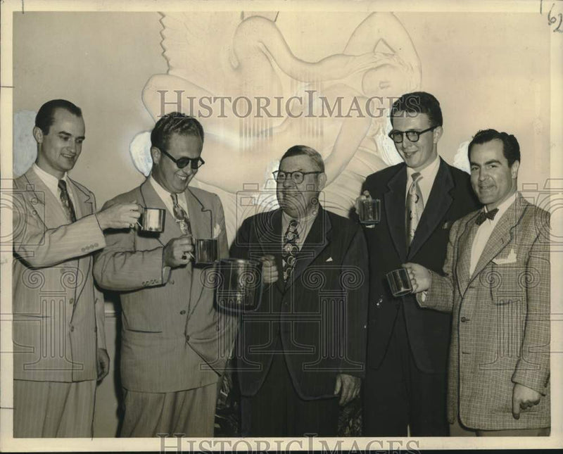 Load image into Gallery viewer, 1950 Press Photo Hy Heath Enjoys Moscow Muth at New Orleans Party with Attendees
