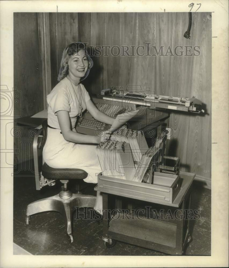 Load image into Gallery viewer, 1957 Press Photo Mrs. Charlotte Holland, NCR operator at Steel Service, Inc.
