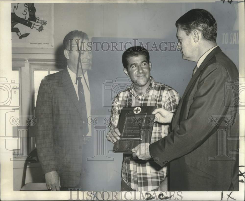 1968 Press Photo Gerald A. Hanzo receives plaque in saving a man from drowning