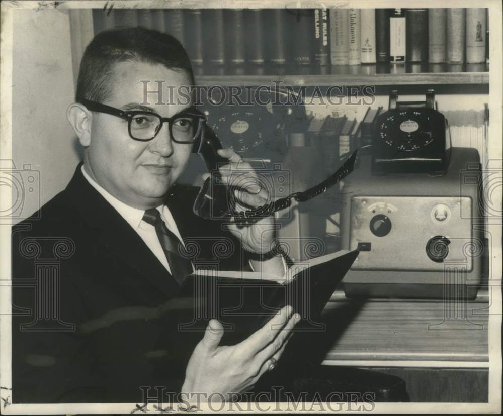 1962 Press Photo Thomas A. Isaacs minister of Gentilly Church on the phone