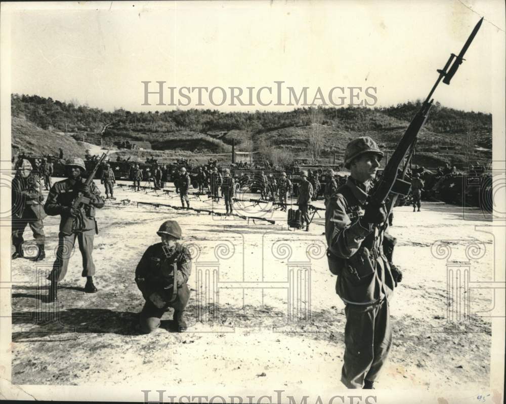 1964 Press Photo Members of Army Company display equipment and fire power