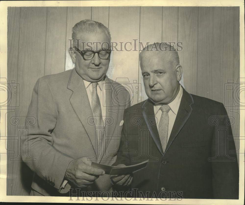 1969 Press Photo A.N. Kreihs donates to Irwin Poche of Children&#39;s Football Fund- Historic Images