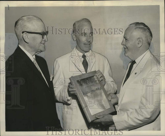 1961 Press Photo International House officials discuss Haiti Hospital Work