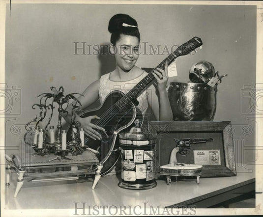 1965 Press Photo Kattleen McNeil with Auctioned Items- Post Office Annual Sale