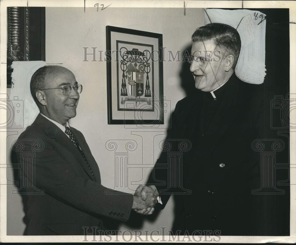 1954 Press Photo Vernon X. Miller shakes-hands with Bishop Bryan McEntegart