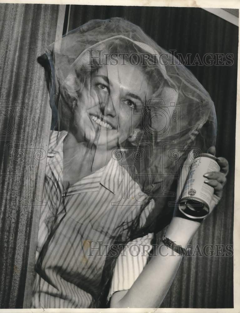 Load image into Gallery viewer, 1960 Press Photo New Orleans-Mrs. Sylvia Rosman, in mosquito net &amp; holding spray
