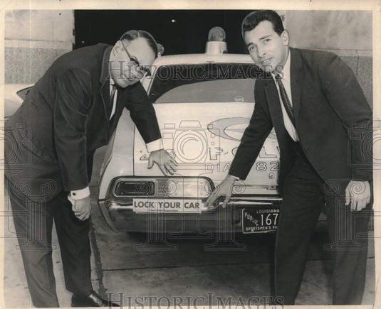 1968 Press Photo Captain Henry Morris shows off "Lock Your Car" bumper stickers- Historic Images