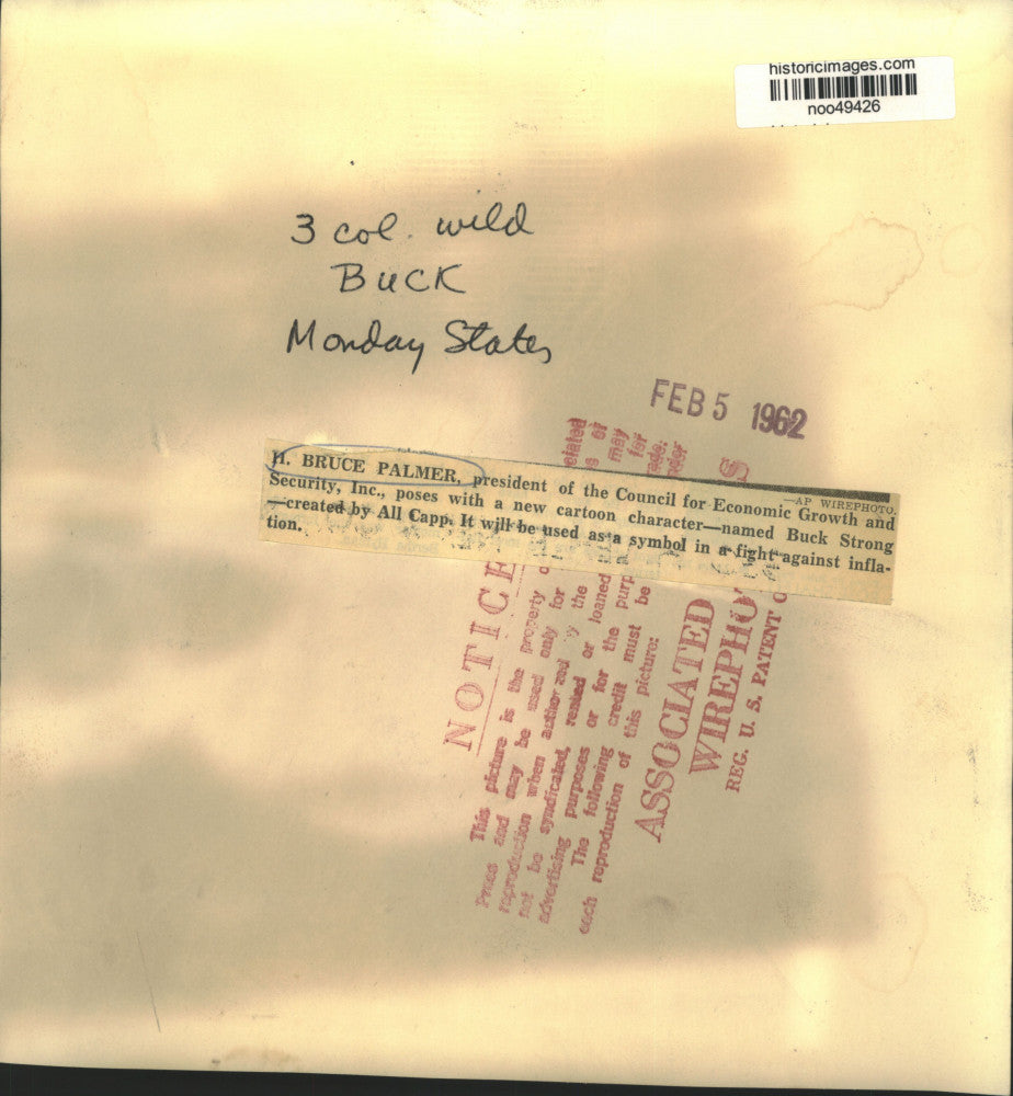 1962 Press Photo H. Bruce Palmer with cartoon "Buck Strong" by Al Capp