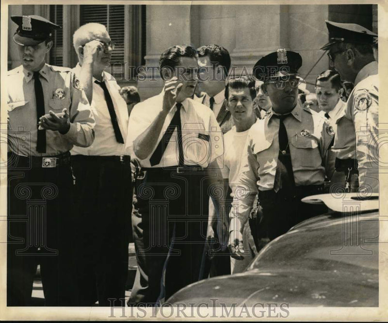 Load image into Gallery viewer, 1961 Press Photo Patrolman Allen Newman driver of run-away police vehicle
