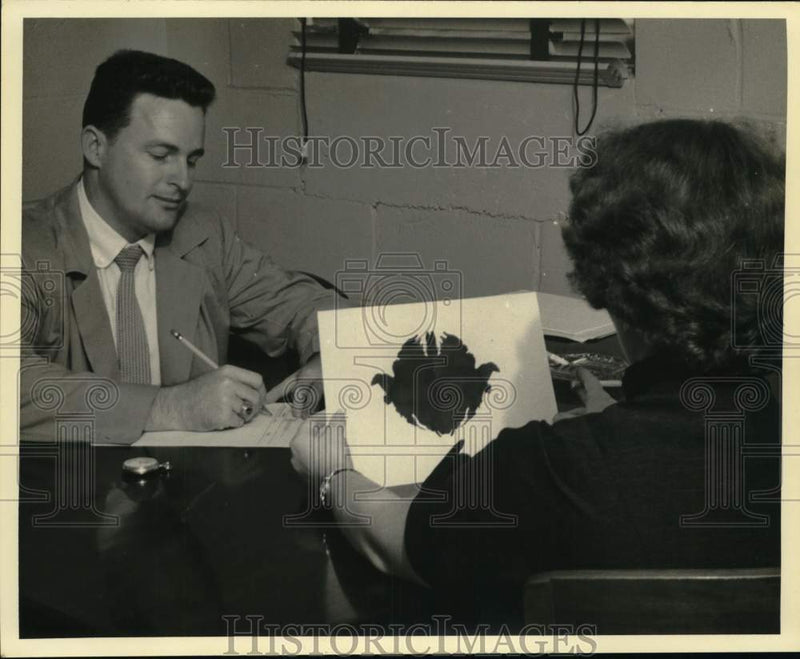 Load image into Gallery viewer, 1955 Press Photo Warren McGovern administers the "ink bot" test to a patient
