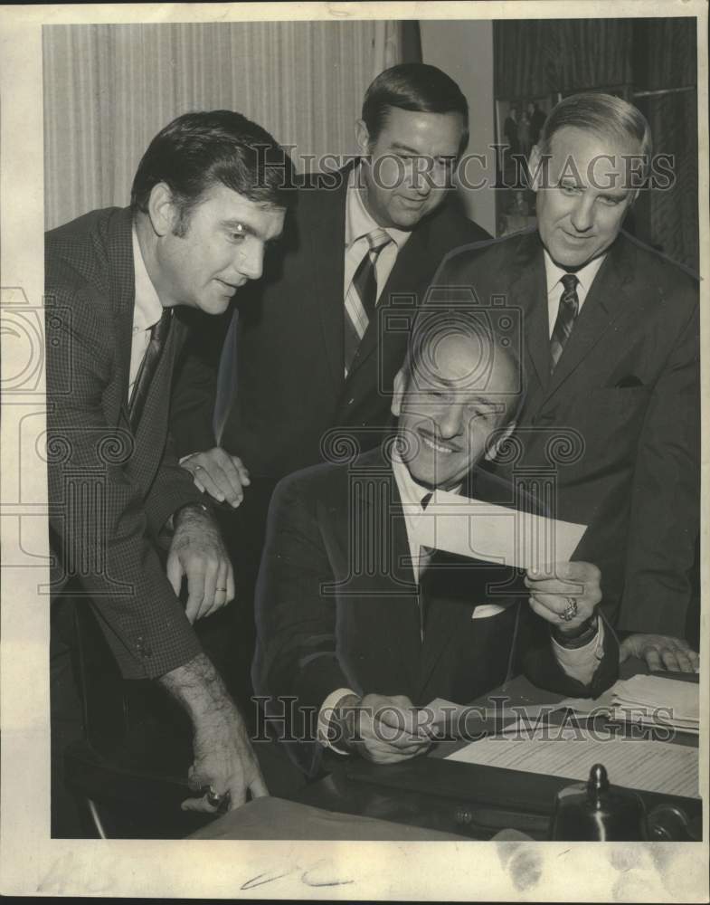 1969 Press Photo Mayor Vic Schiro looks at Check from Baseball Program with Men