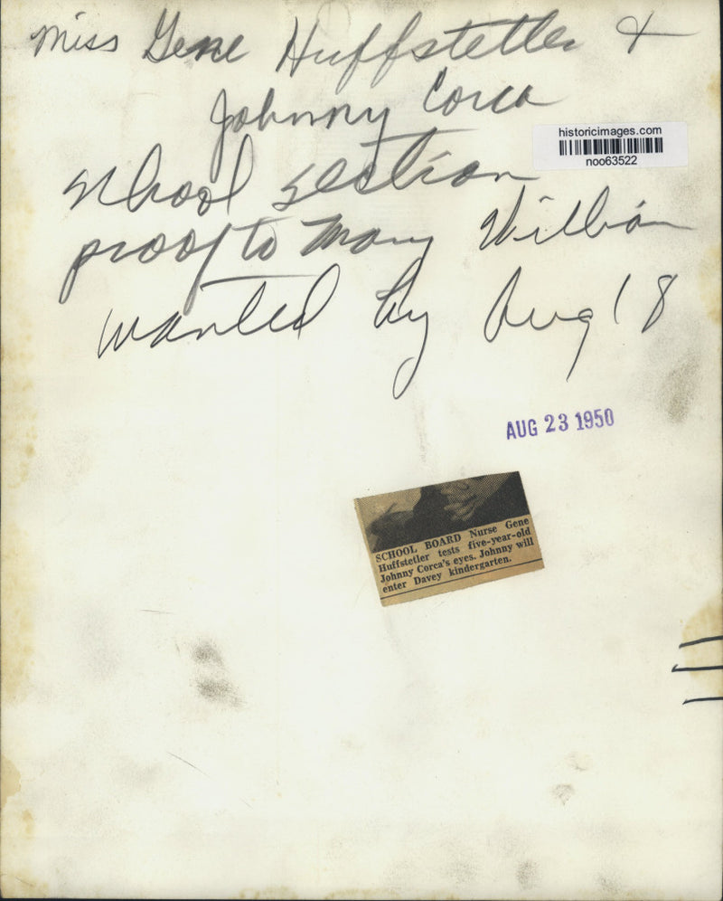 Load image into Gallery viewer, 1950 Press Photo School Board nurse Gene Huffstetler tests Johnny Corca's eyes
