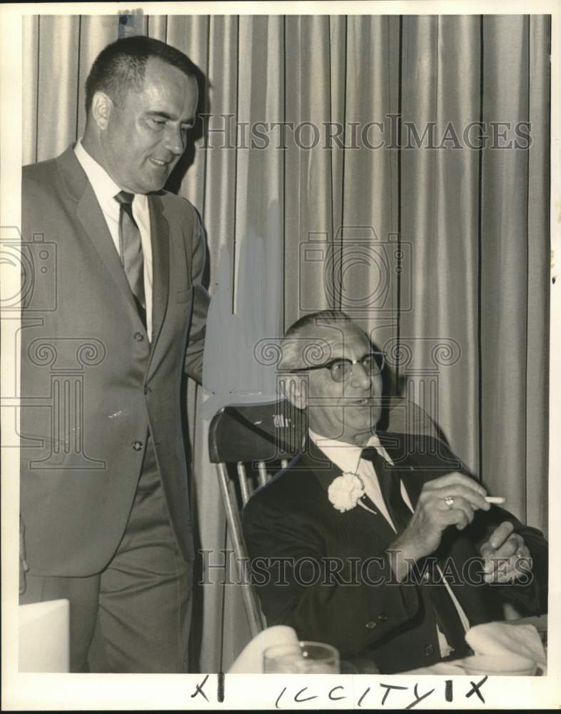 Load image into Gallery viewer, 1966 Press Photo Bill Mitchell presents retirement rocker to Jules Wittenberger
