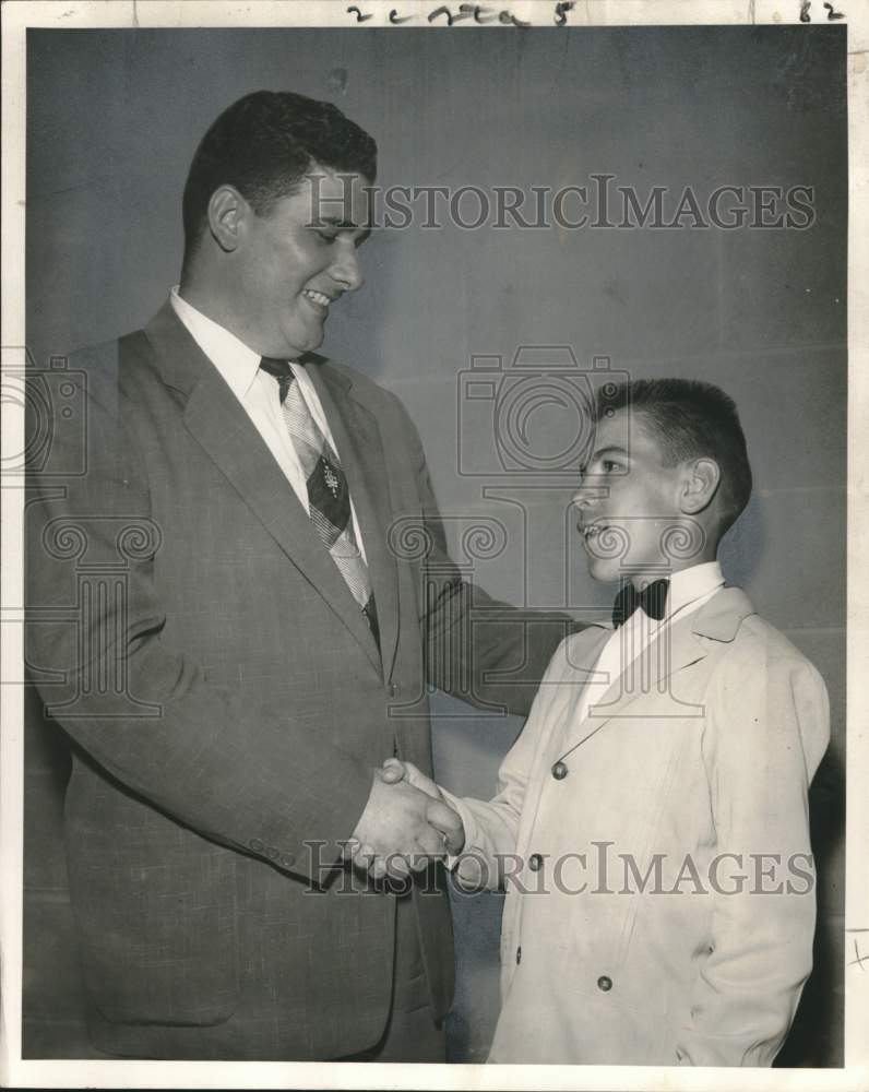 1955 Press Photo Teenagers Club President Charles Wild congratulated by P. Burke- Historic Images