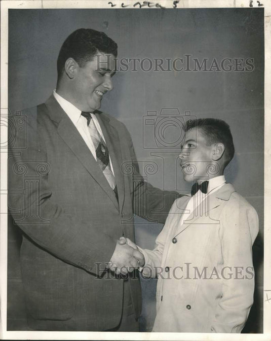 1955 Press Photo Teenagers Club President Charles Wild congratulated by P. Burke- Historic Images