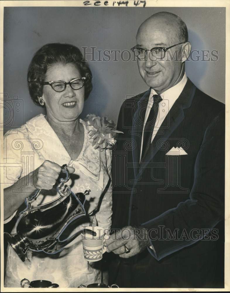 Load image into Gallery viewer, 1964 Press Photo Mrs. Wilson pours cup of tea for husband Reverend George Wilson
