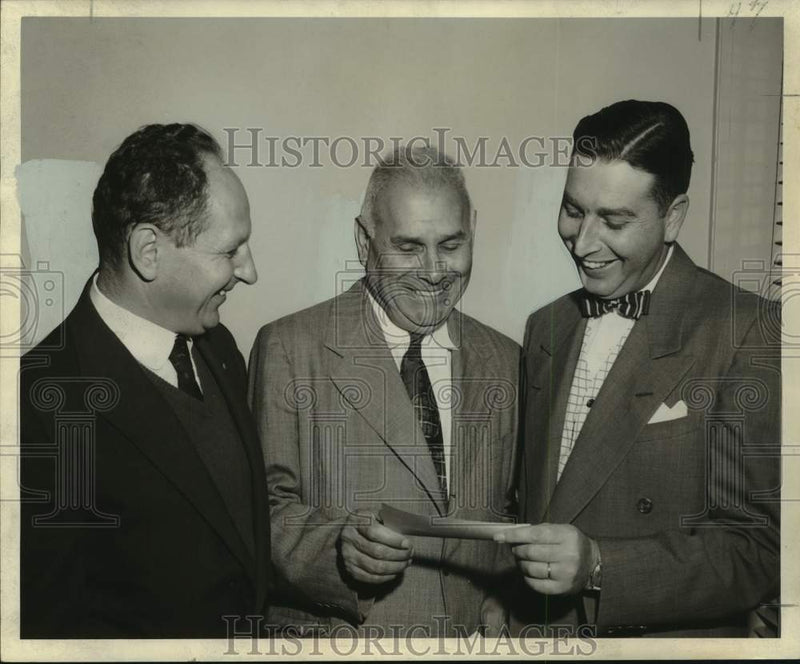 Load image into Gallery viewer, 1955 Press Photo Joseph Cahn and Camille Weis present checks to Sol Shnaider
