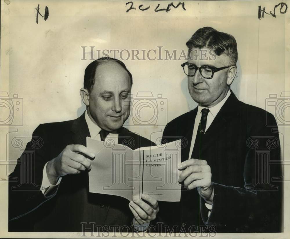 1961 Press Photo Officials of American Board of Examiners examine a booklet