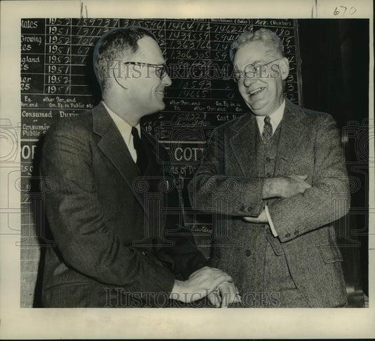 1953 Press Photo Stock Exchange officials J.B. Shober and Funston confer in LA