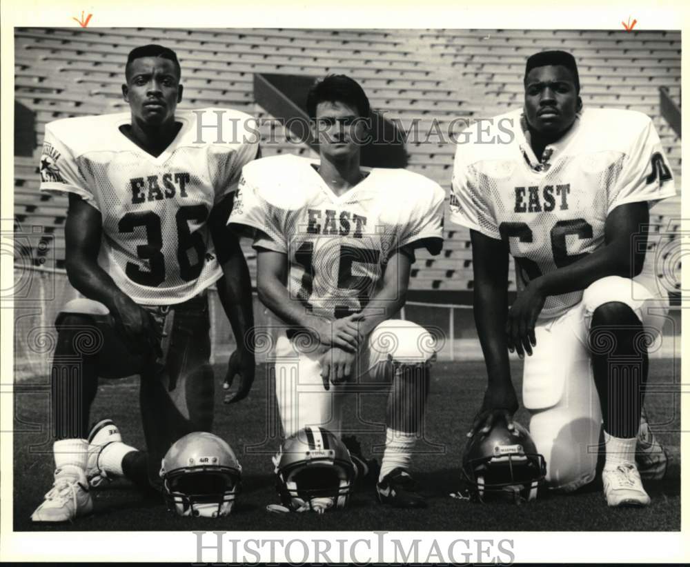 1990 Press Photo Football Players Ricardo Washington, Mike Rogers, Tyrone Holmes- Historic Images