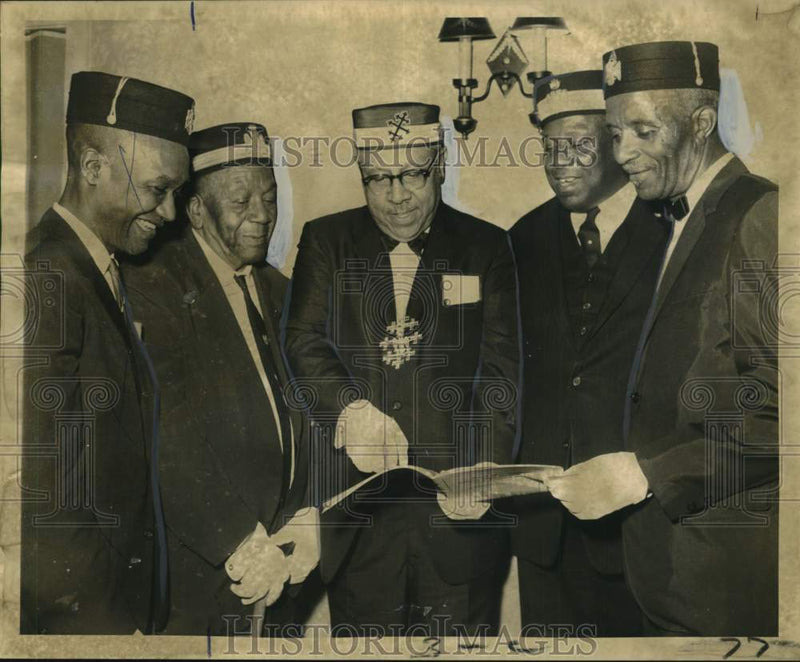 Load image into Gallery viewer, 1969 Press Photo Officials study program of Pelican Council of Deliberation
