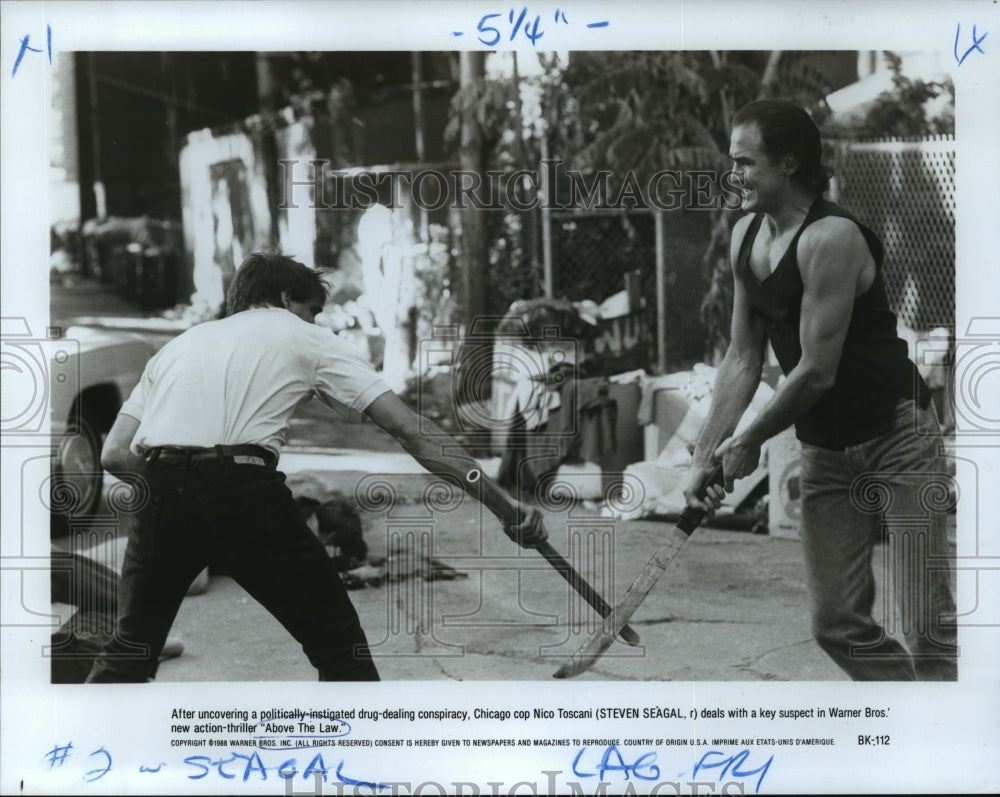 1988 Press Photo Steven Seagal in a scene from Above the Law. - nop01259- Historic Images