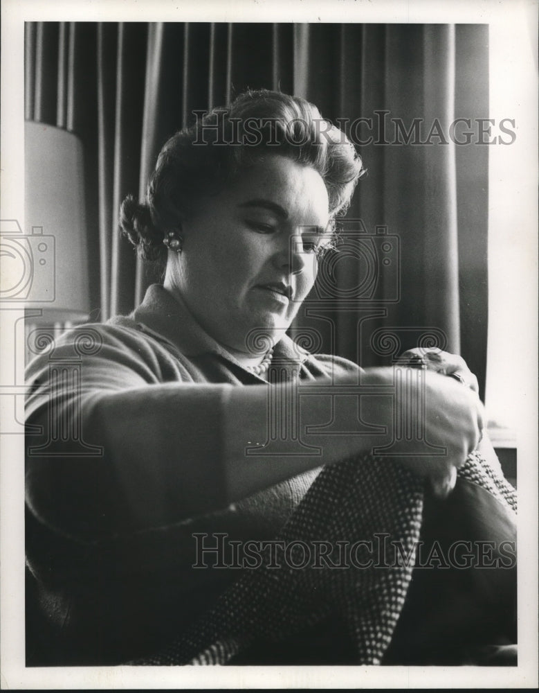 1960 Press Photo Ellen Farrell, holding a jacket - nop26795- Historic Images