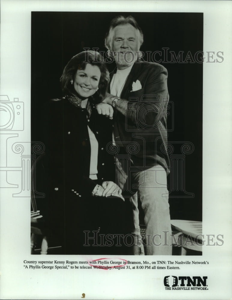 Load image into Gallery viewer, 1994 Press Photo Country superstar Kenny Rogers meets with Phyllis George on TNN
