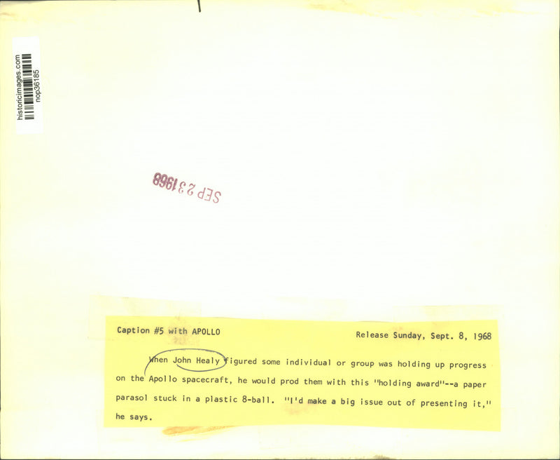 Load image into Gallery viewer, 1968 Press Photo John Healy with a paper parasol stuck in a plastic 8-ball

