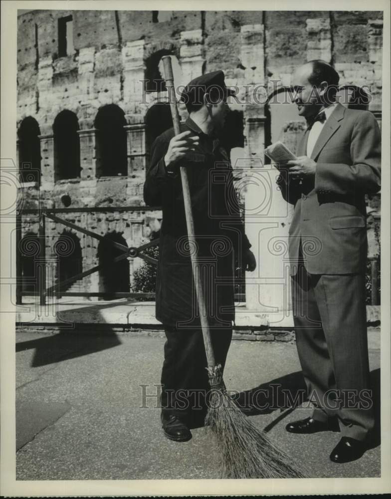Load image into Gallery viewer, 1961 Press Photo Irving R. Levine and a street sweeper in Rome, on NBC News.
