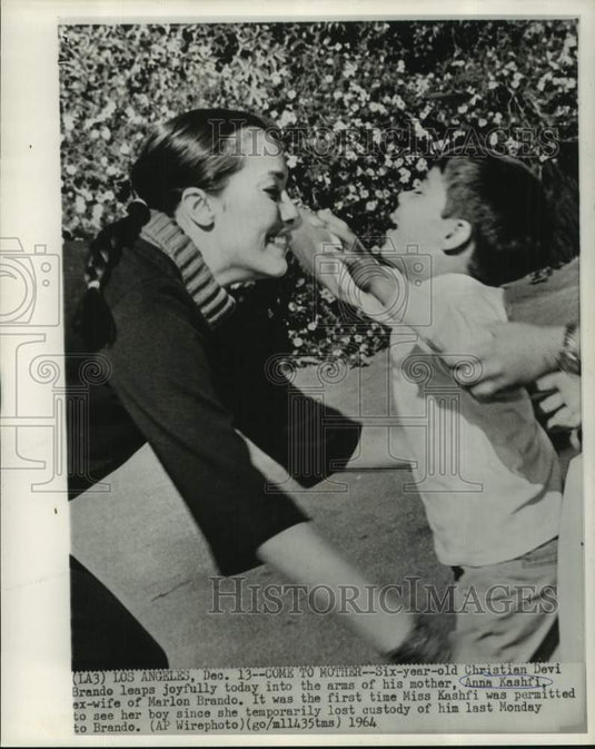1964 Press Photo Christian Devi Brando leaps joyfully to his mother Anna Kashfi