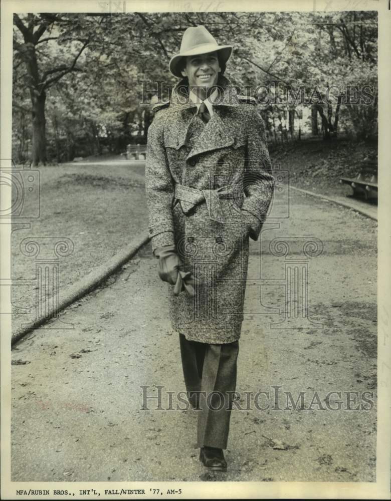 1977 Press Photo Model wears double-breasted trench coat by Rubin Brothers