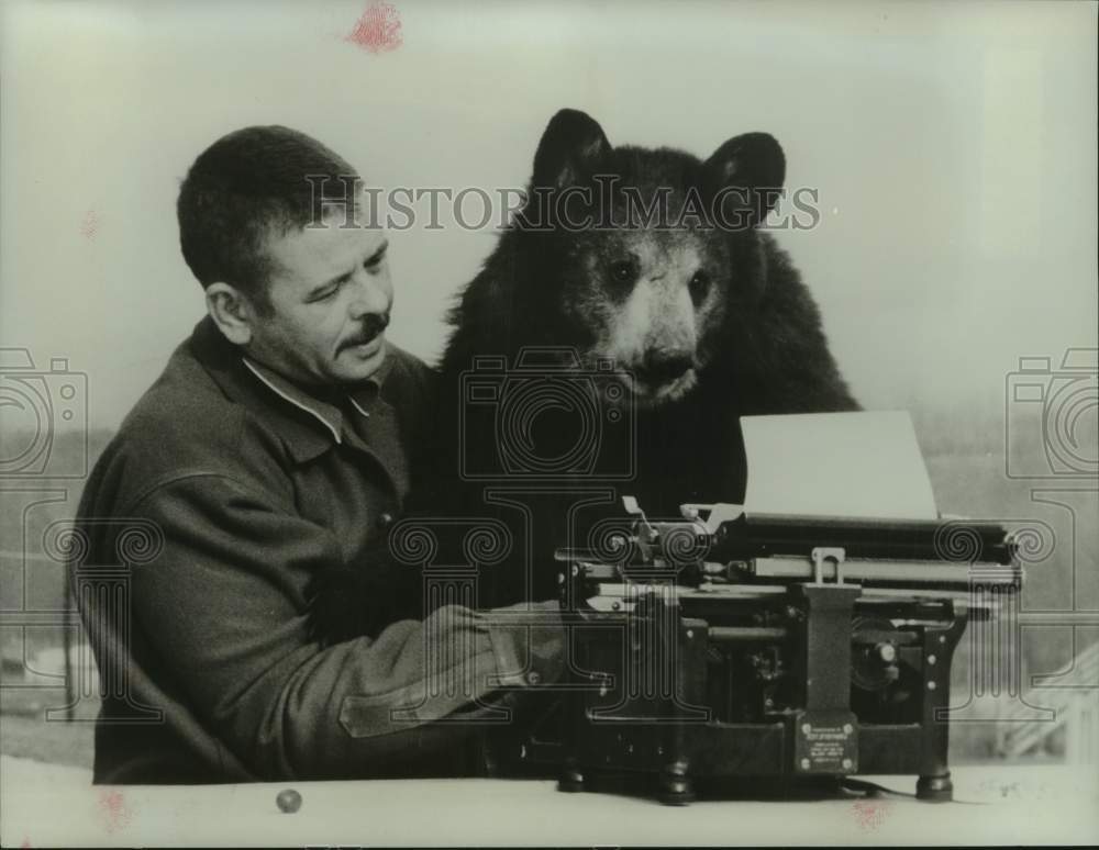 1966 Press Photo A bear learning to type. - nop59084