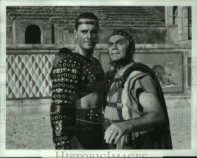 Load image into Gallery viewer, 1984 Press Photo Duncan Regehr &amp; Ernest Borgnine in "The Last Days of Pompeii"
