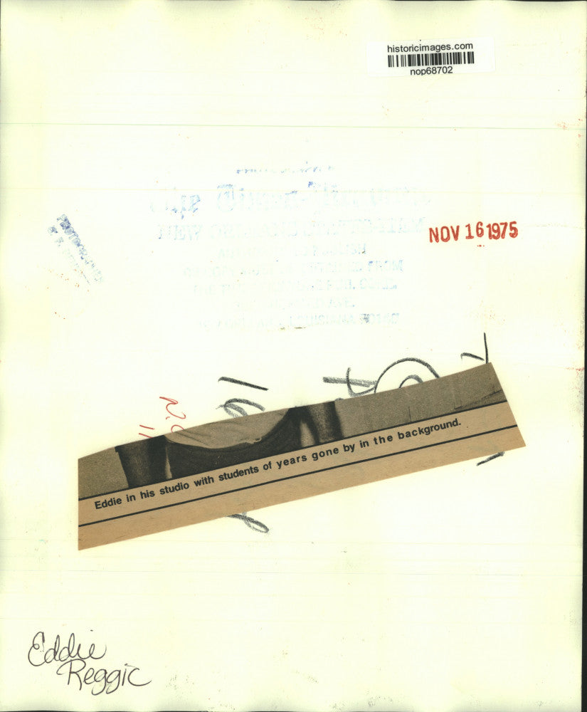 1975 Press Photo Eddie Reggic in his studio with images of former students