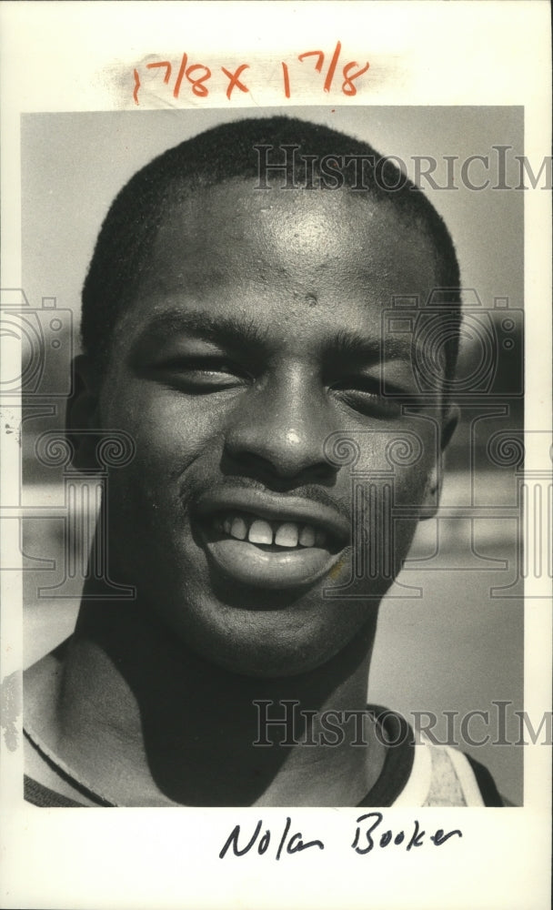 1984 Press Photo Track and Fielder Nolan Booker - nos04611- Historic Images