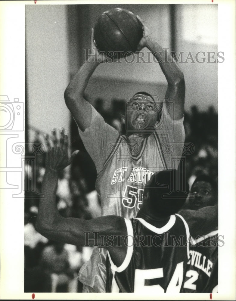 1991 Press Photo Basketball - St. Augustine&#39;s Marco Borne Over Mandeville Player- Historic Images