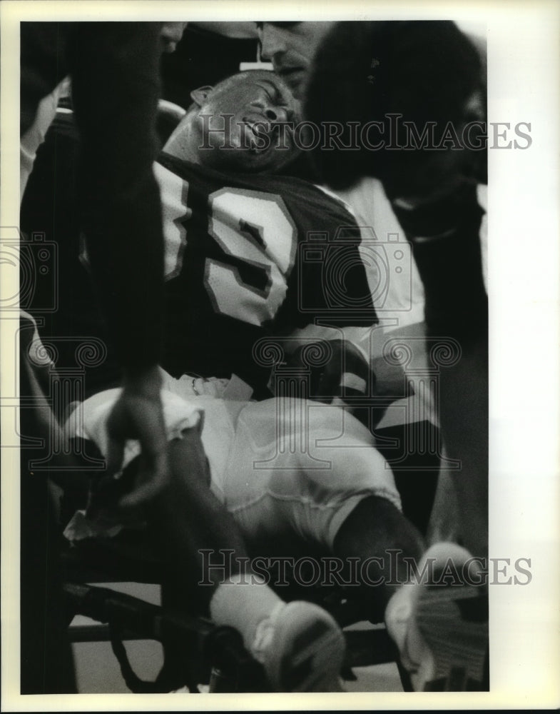 1989 Press Photo Football - Tulane&#39;s Rico Chung Injured in Game - nos06145- Historic Images