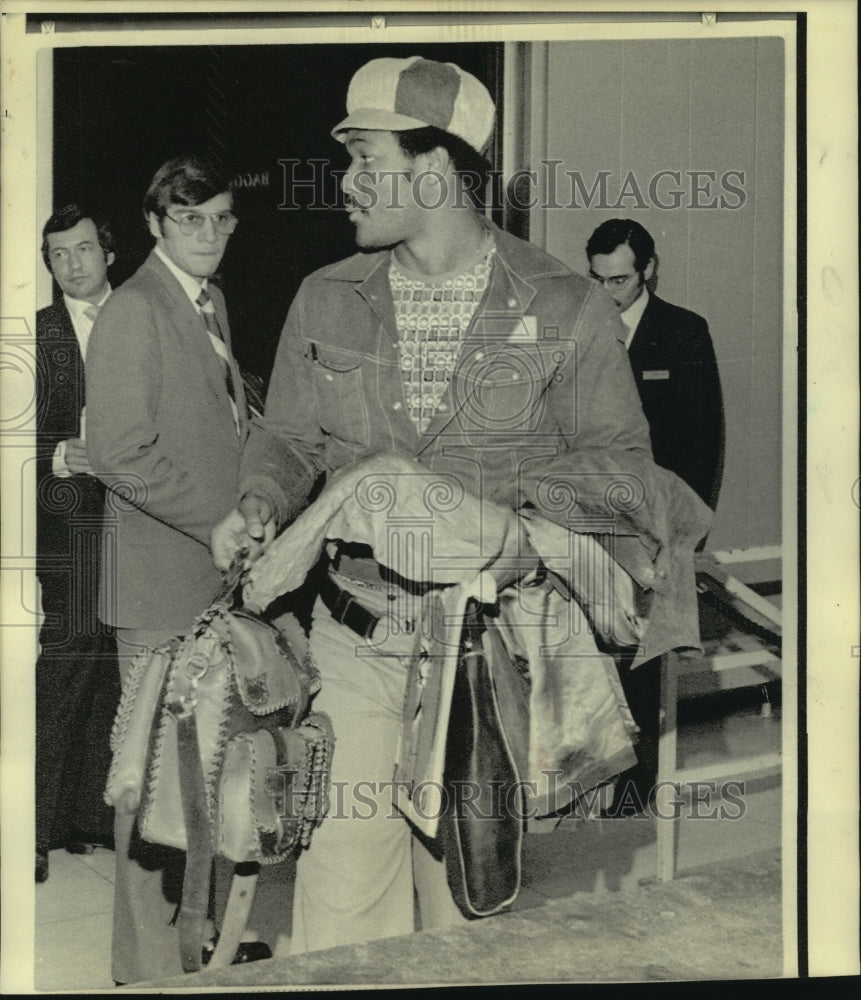 1974 Press Photo George Foreman, Heavyweight Champion Boxer at Houston Airport- Historic Images