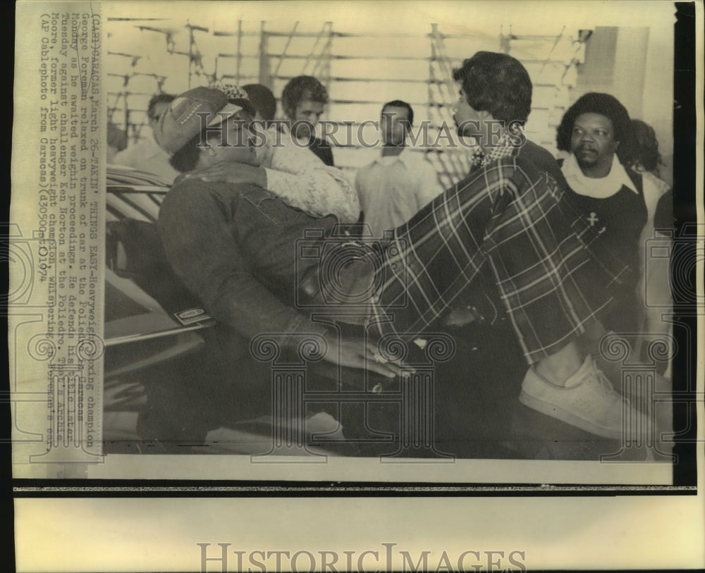 1974 Press Photo Boxing champion George Foreman relaxes before weigh in, Caracas- Historic Images