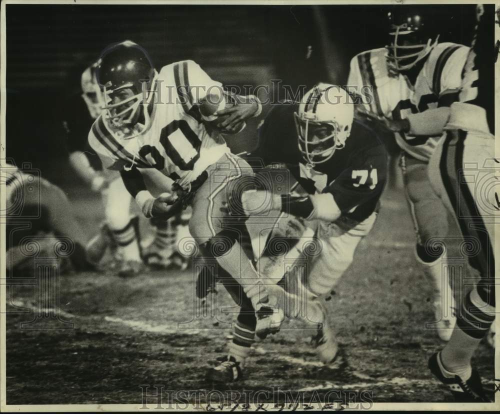 1977 Press Photo Bonnabel High football defender Donald Harness in action- Historic Images