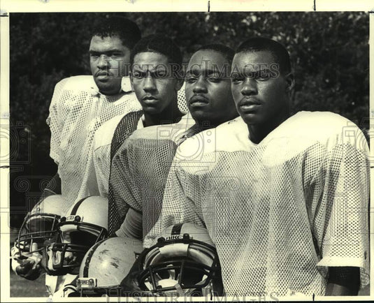 1988 Press Photo Purple Knights football player Tyrone Hughes and teammates- Historic Images