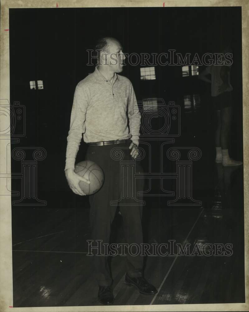 1968 Press Photo Bob Luksta, Loyola Cage (basketball) Coach stands with ball - Historic Images