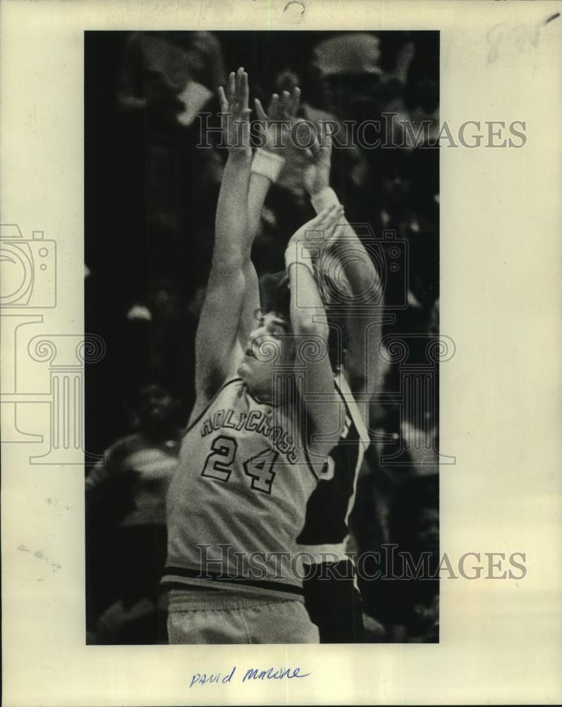 1978 Press Photo Holy Cross basketball player David Malone gets hit as he shoots- Historic Images