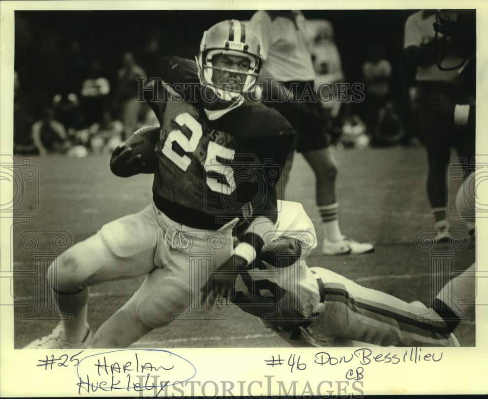 1980 Press Photo Football player Harlan Huckleby is tackled by Don Bessillieu- Historic Images