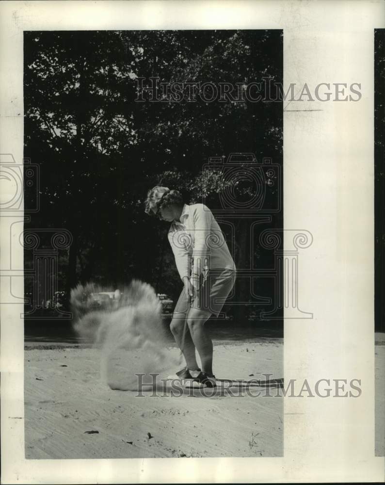 1964 Press Photo Golfer Mary Mills hits out of a sand trap during a match- Historic Images